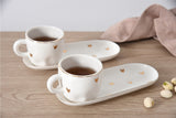 Set of 2 Gold Porcelain Espresso Cups & Saucers