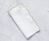 White scalloped napkins for weddings