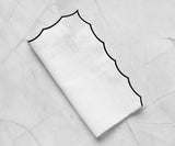 White scalloped napkins for weddings