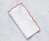 White scalloped napkins for weddings