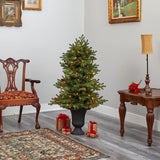 4.5’ Yukon Mountain Fir Artificial Christmas Tree with 100 Clear Lights, Pine Cones and 386 Bendable Branches in Charcoal Planter