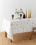 Olive orchard print on white linen tablecloth