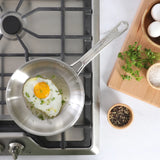Sur La Table Kitchen Essentials Chef's Deck Stainless Steel Frying Pan – Induction Ready Skillet with Tri-Ply Base, Polished Finish & Hollow Stay-Cool Handle