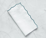 White scalloped napkins for weddings