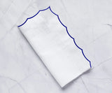 White scalloped napkins for weddings