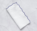 White scalloped napkins for weddings