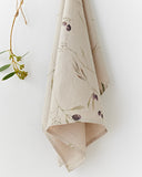Linen tea towel in Olive orchard print on natural