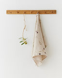 Linen tea towel in Olive orchard print on natural
