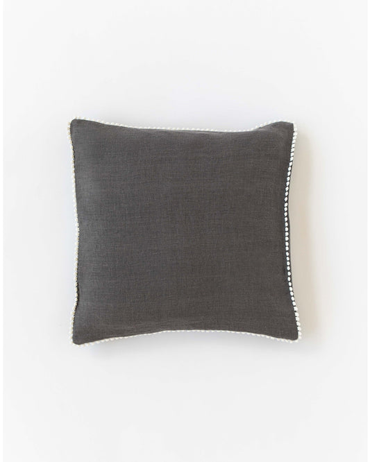 Cushion cover with pom poms in Charcoal gray