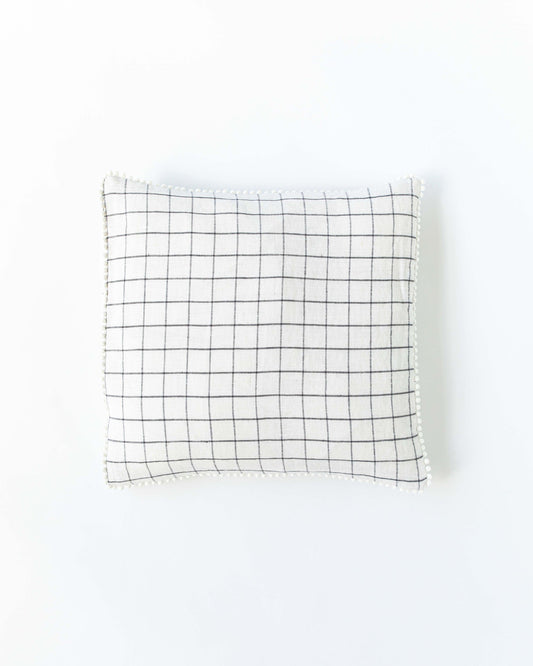 Cushion cover with pom poms in Charcoal grid